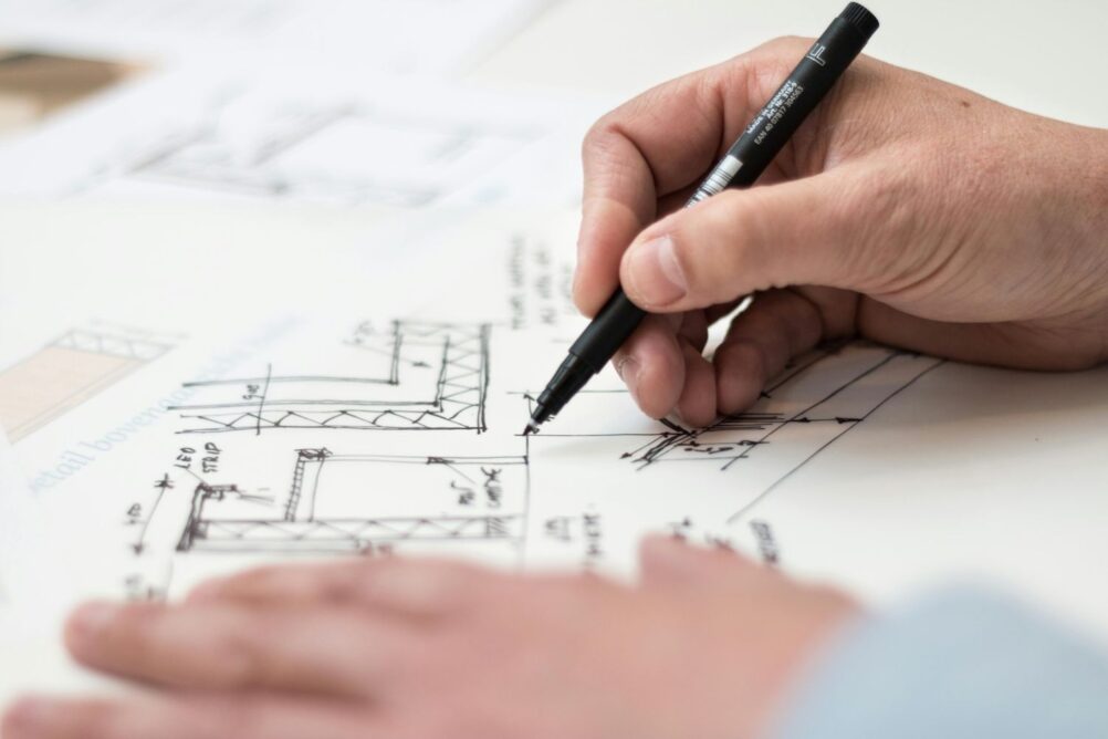 Close up view of someone hand-drawing a site plan